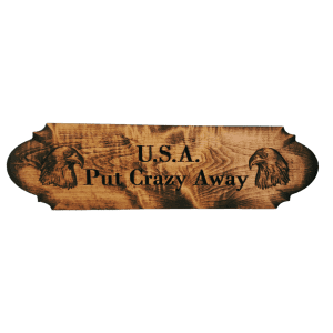 A wooden sign with an image of elephants.