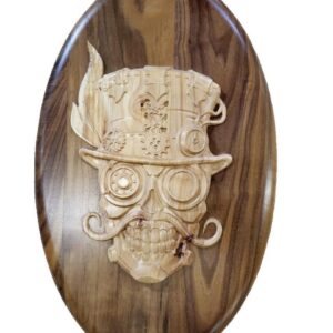 Carved wooden plaque of a skull character.