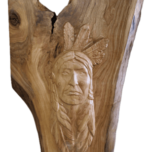 Wood carving of a Native American figure.